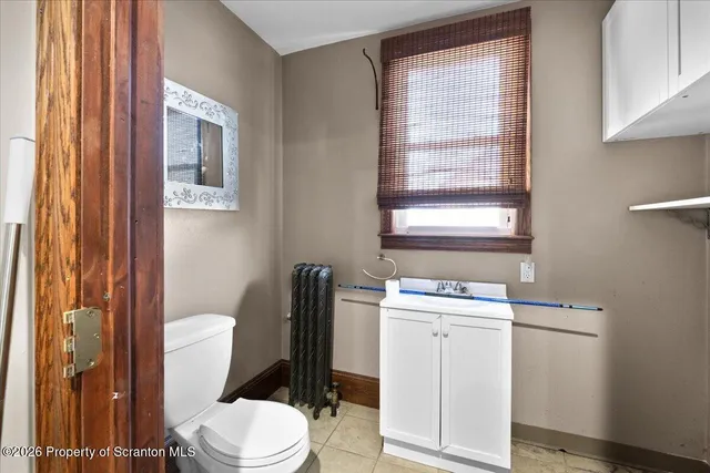 a storage room with wooden floor washer and dryer