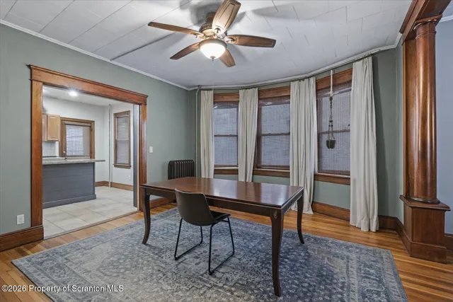 a kitchen with granite countertop lots of clutter and stainless steel appliances