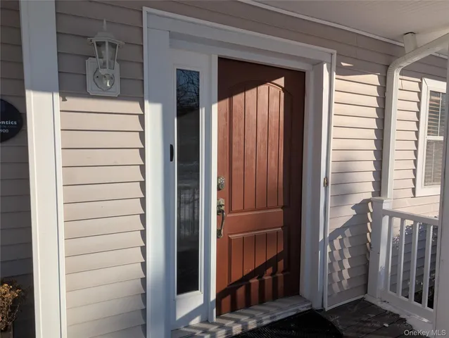 a kitchen with stainless steel appliances granite countertop a sink dishwasher stove and wooden floor