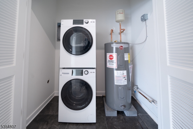 12 River Road, Unit 303 Fair Lawn, NJ 07410 - Photo 8 of 9 a utility room with dryer and washer