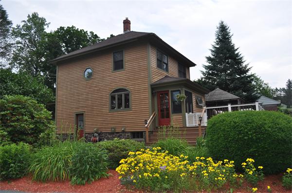 44 Silver Street Greenfield, MA 01301 - Photo 1 of 25 a front view of a house with a yard