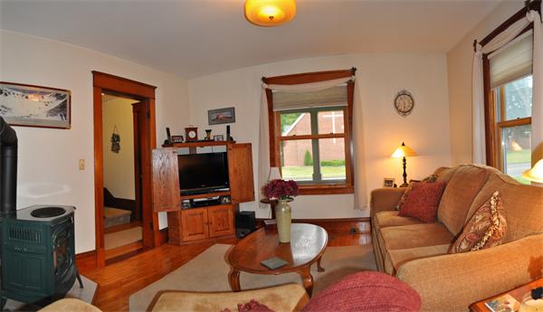 44 Silver Street Greenfield, MA 01301 - Photo 12 of 25 a living room with furniture and a flat screen tv