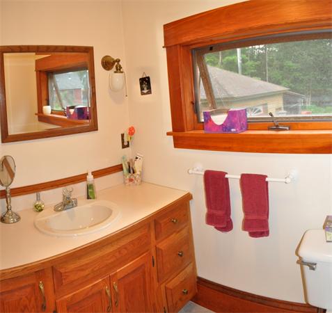 44 Silver Street Greenfield, MA 01301 - Photo 15 of 25 a bathroom with a sink mirror and vanity