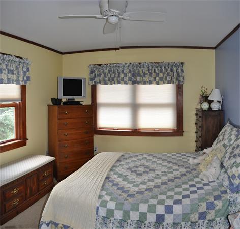 44 Silver Street Greenfield, MA 01301 - Photo 20 of 25 a bedroom with a bed and a flat tv screen on dresser