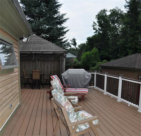 44 Silver Street Greenfield, MA 01301 - Photo 24 of 25 a view of deck with table and chairs potted plants with wooden floor and fence