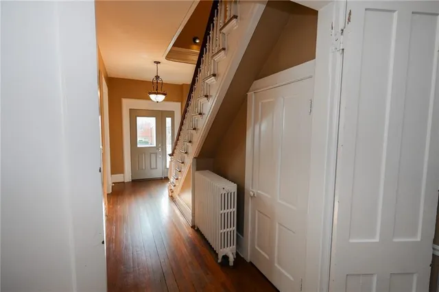 a bathroom with a sink a mirror and a shower curtain