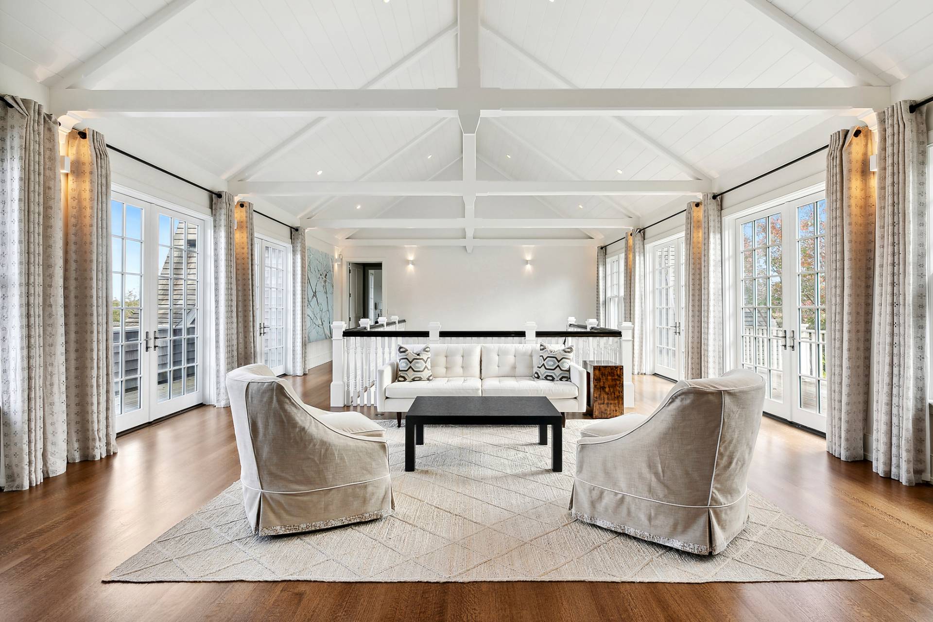 461 Ocean Road Bridgehampton, NY 11932 - Photo 13 of 29 a living room with furniture and wooden floor