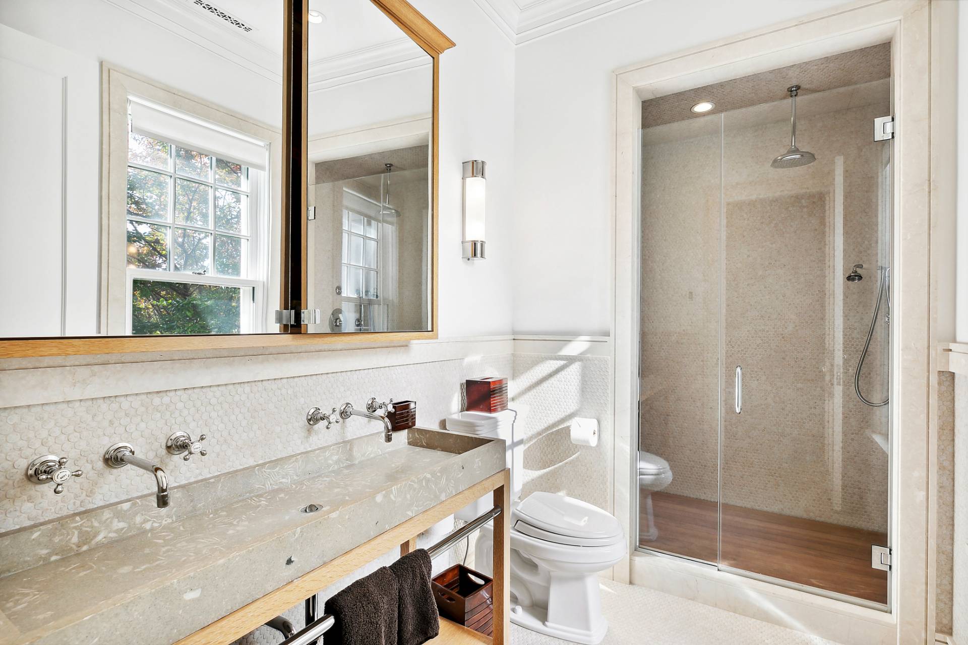 461 Ocean Road Bridgehampton, NY 11932 - Photo 15 of 29 a bathroom with a granite countertop sink a toilet a mirror and shower