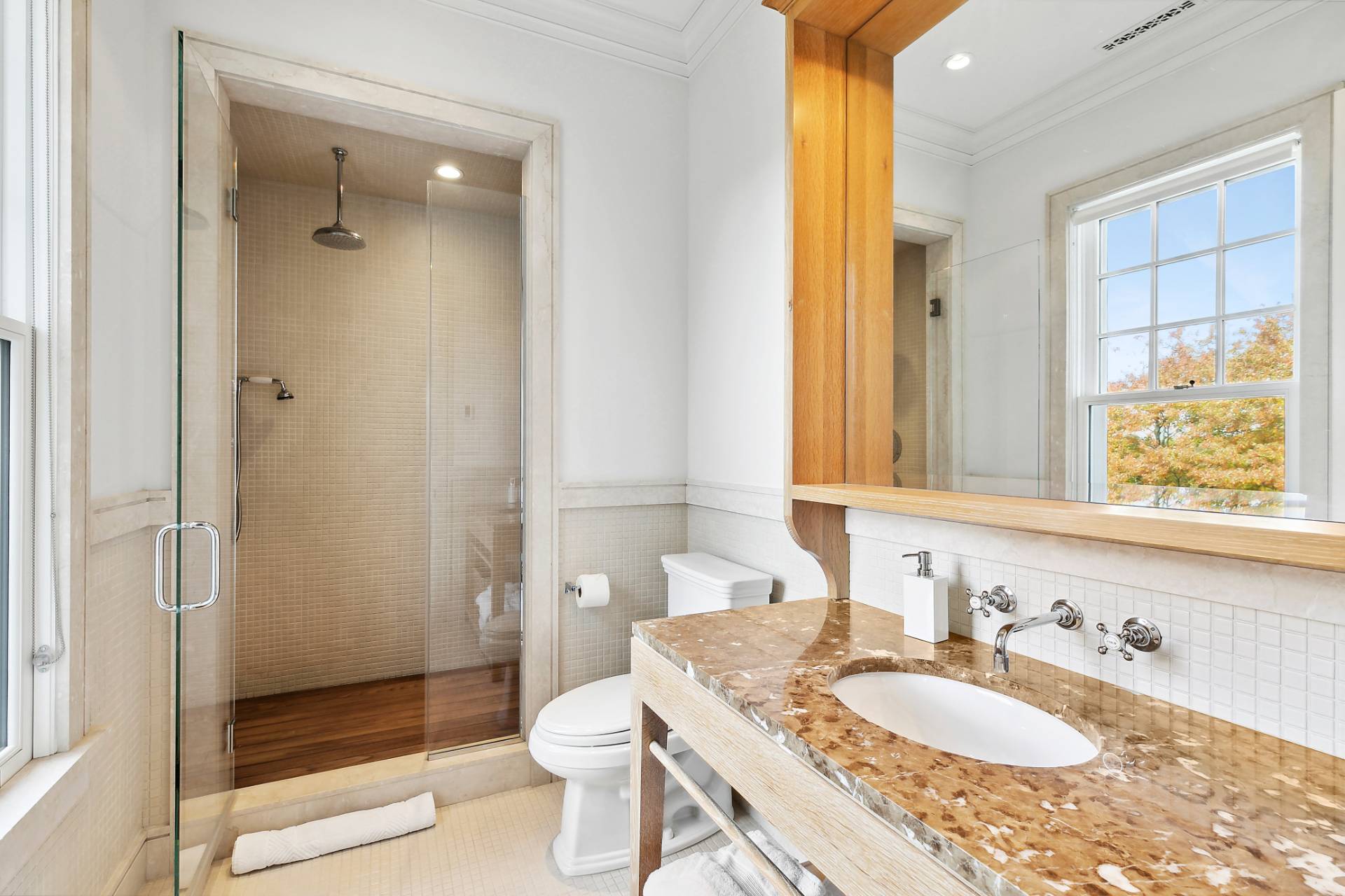 461 Ocean Road Bridgehampton, NY 11932 - Photo 17 of 29 a bathroom with a granite countertop sink toilet and shower