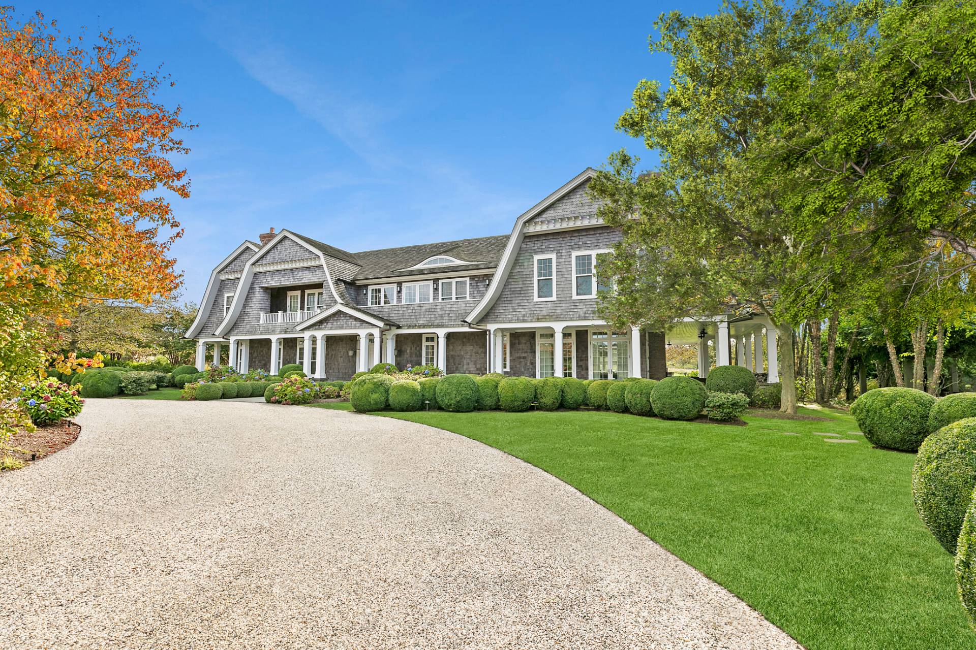 461 Ocean Road Bridgehampton, NY 11932 - Photo 2 of 29 a front view of a house with a garden