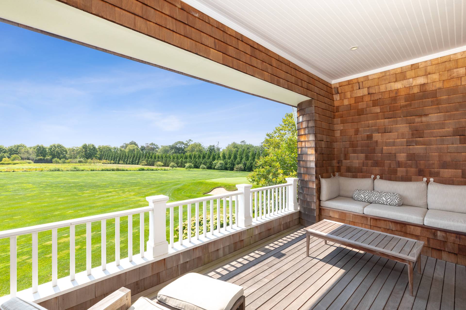 461 Ocean Road Bridgehampton, NY 11932 - Photo 3 of 29 a balcony with wooden floor and lake view