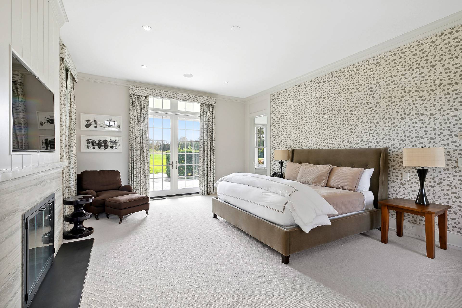 461 Ocean Road Bridgehampton, NY 11932 - Photo 10 of 29 a spacious bedroom with a bed and a couch