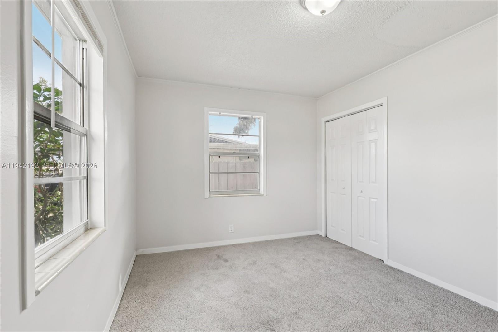3209 Scanlan Avenue Lake Worth, FL 33461 - Photo 19 of 41 a view of an empty room with a window
