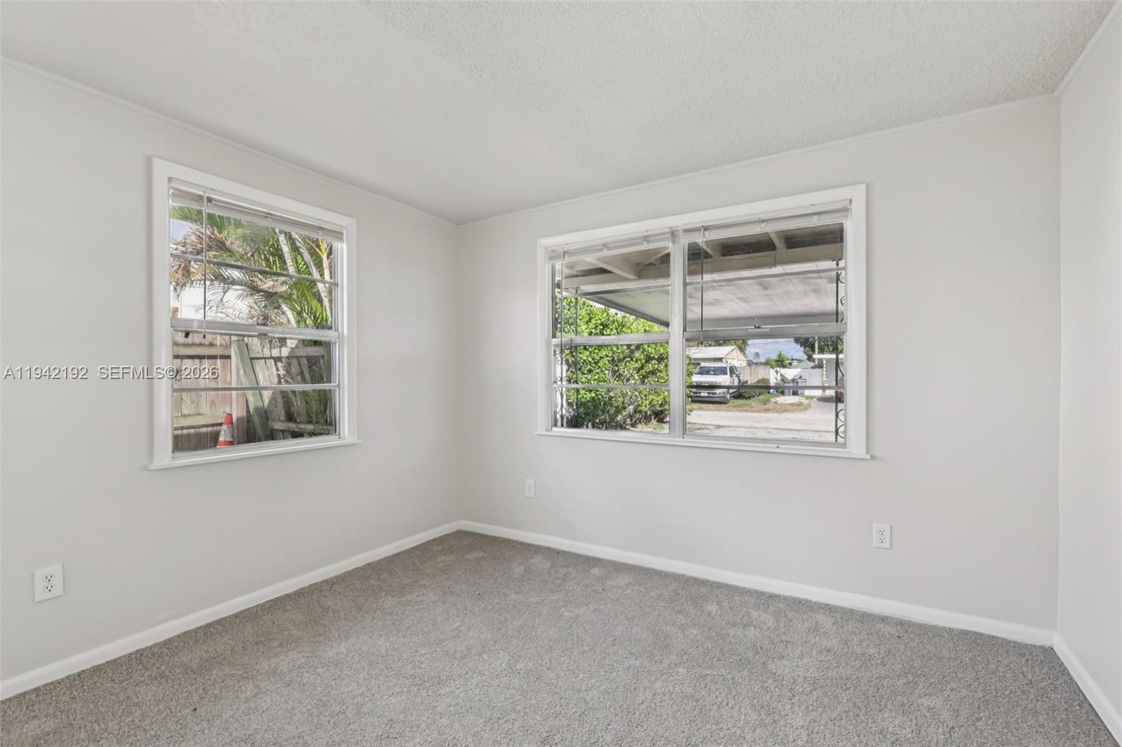 3209 Scanlan Avenue Lake Worth, FL 33461 - Photo 22 of 41 an empty room with a window