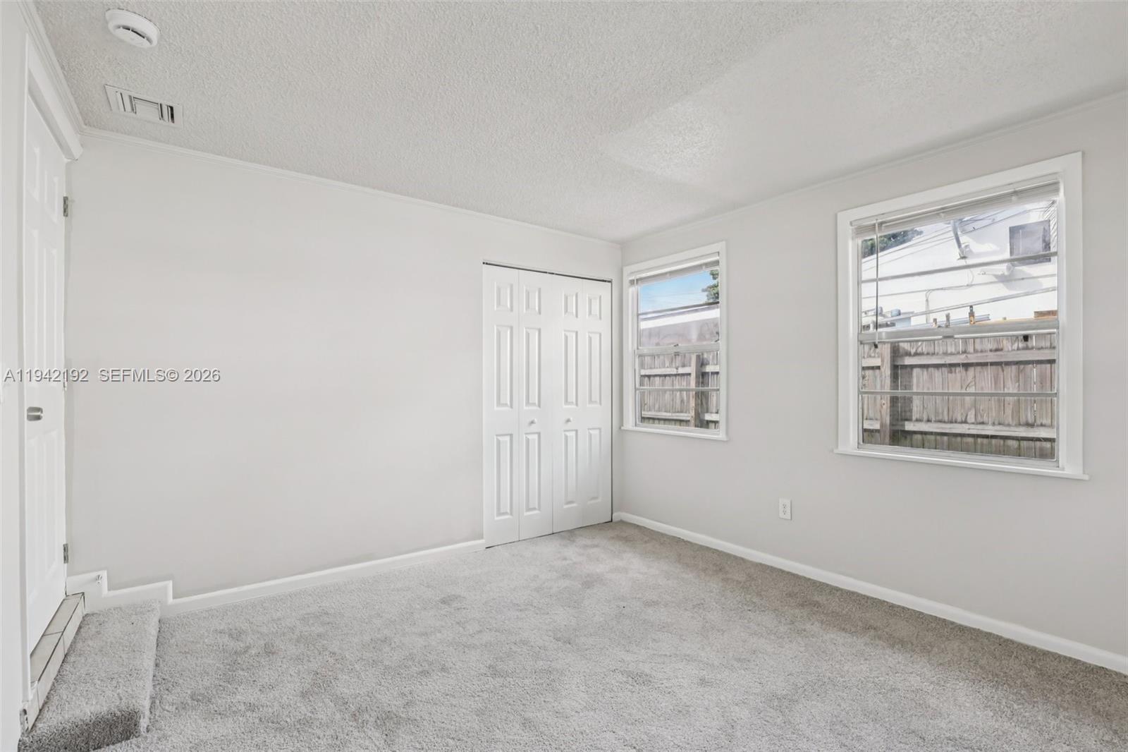 3209 Scanlan Avenue Lake Worth, FL 33461 - Photo 26 of 41 a view of an empty room with a window