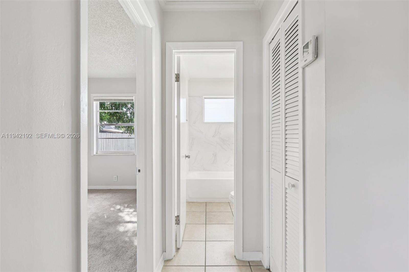 3209 Scanlan Avenue Lake Worth, FL 33461 - Photo 27 of 41 a view of a bathroom with a glass door