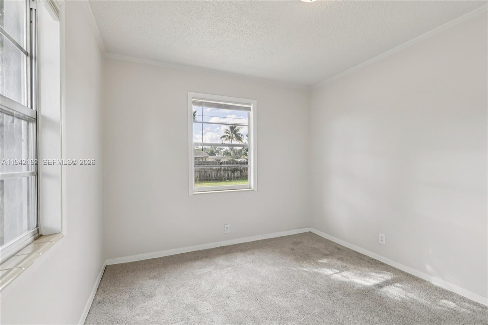 3209 Scanlan Avenue Lake Worth, FL 33461 - Photo 29 of 41 an empty room with a window