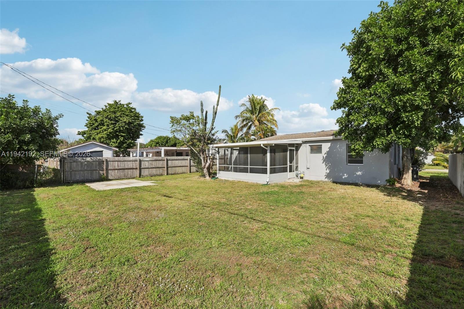 3209 Scanlan Avenue Lake Worth, FL 33461 - Photo 39 of 41 a front view of a house with a garden