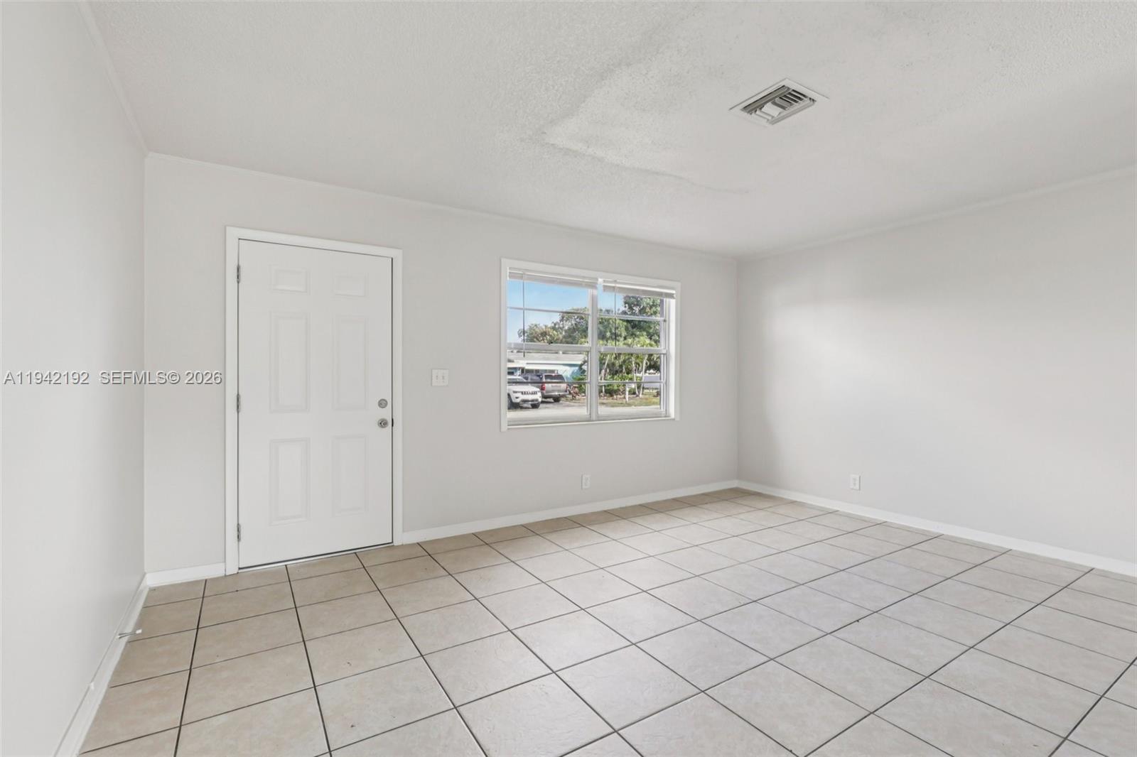 3209 Scanlan Avenue Lake Worth, FL 33461 - Photo 7 of 41 a view of an empty room and window