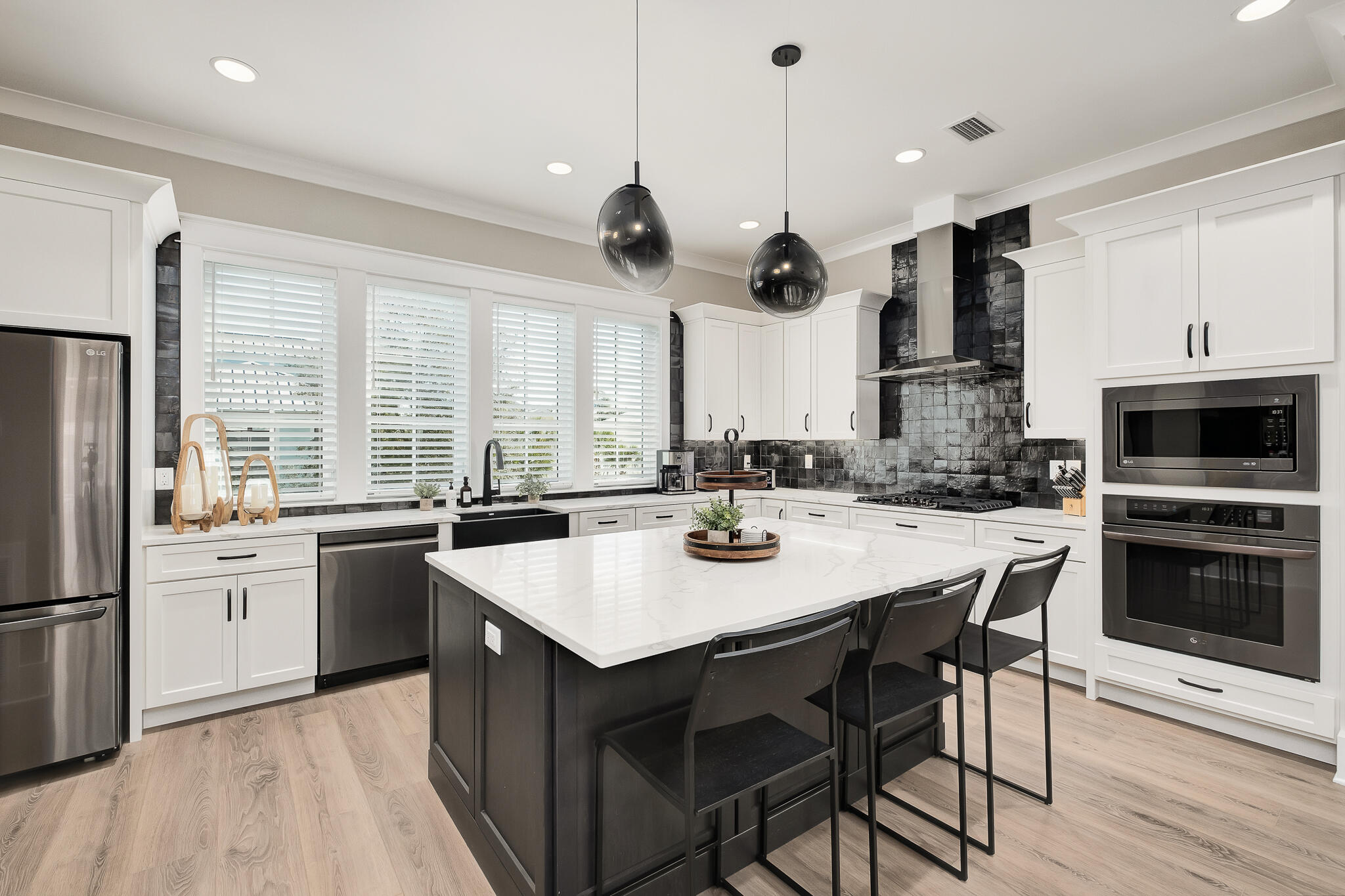107 Grande Pointe Dr Inlet Beach Inlet Beach, FL 32461 - Photo 15 of 78 a kitchen with stainless steel appliances granite countertop a sink a stove a refrigerator a dining table and chairs