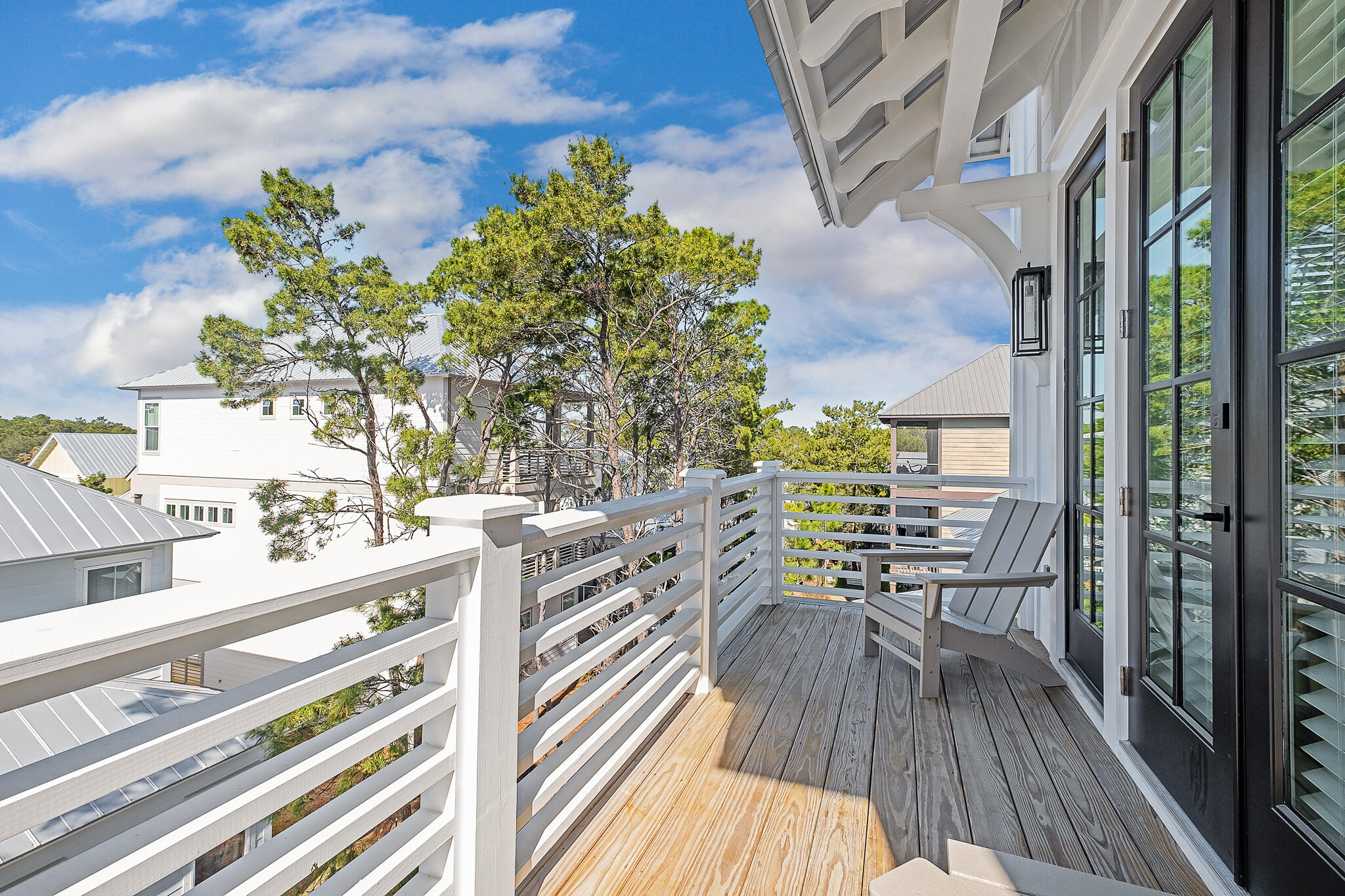 107 Grande Pointe Dr Inlet Beach Inlet Beach, FL 32461 - Photo 21 of 78 a view of balcony with furniture and wooden floor