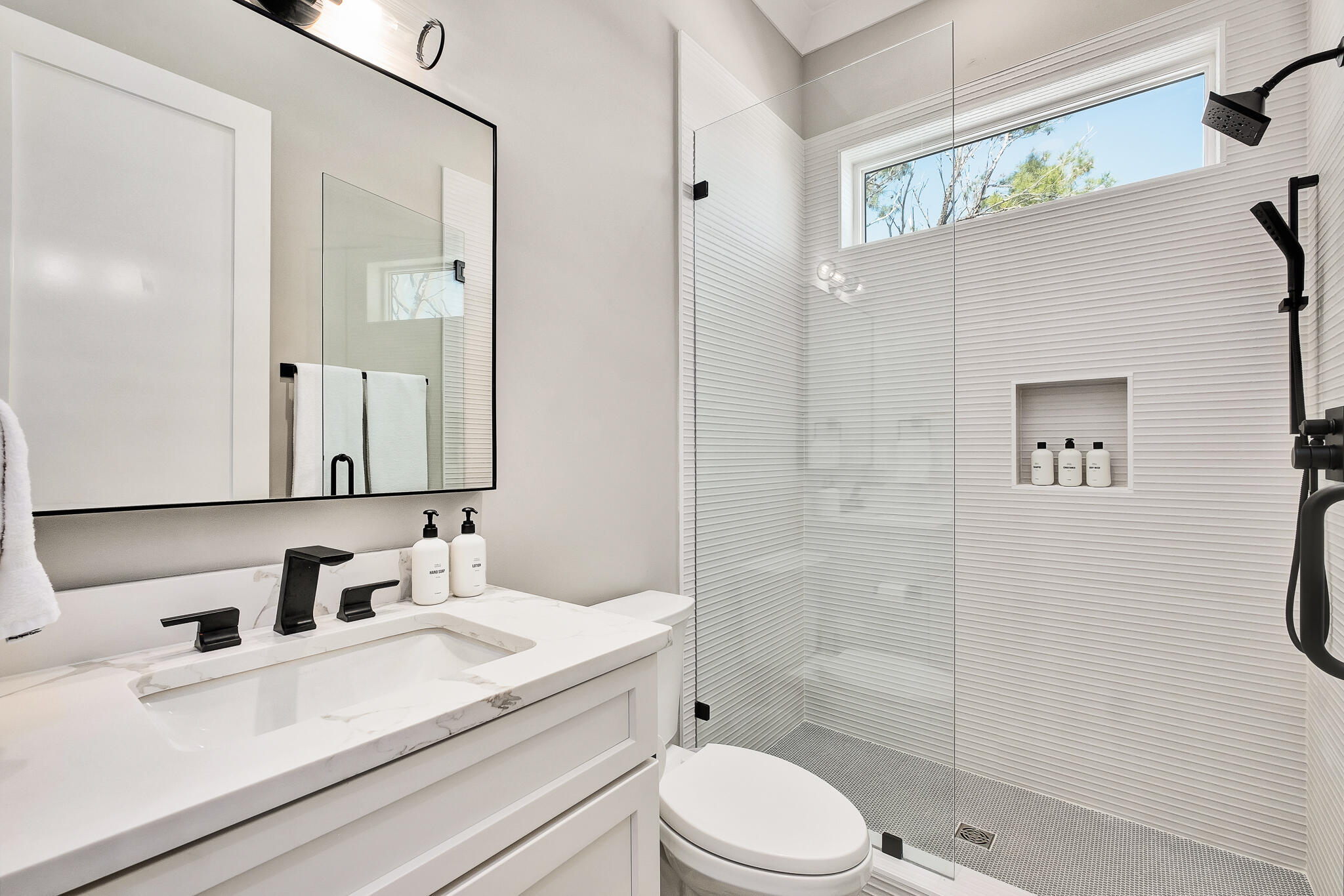 107 Grande Pointe Dr Inlet Beach Inlet Beach, FL 32461 - Photo 41 of 78 a bathroom with a sink a toilet and shower