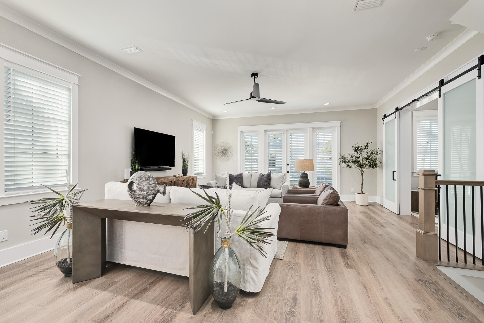 107 Grande Pointe Dr Inlet Beach Inlet Beach, FL 32461 - Photo 7 of 78 a living room with furniture a flat screen tv and a large window