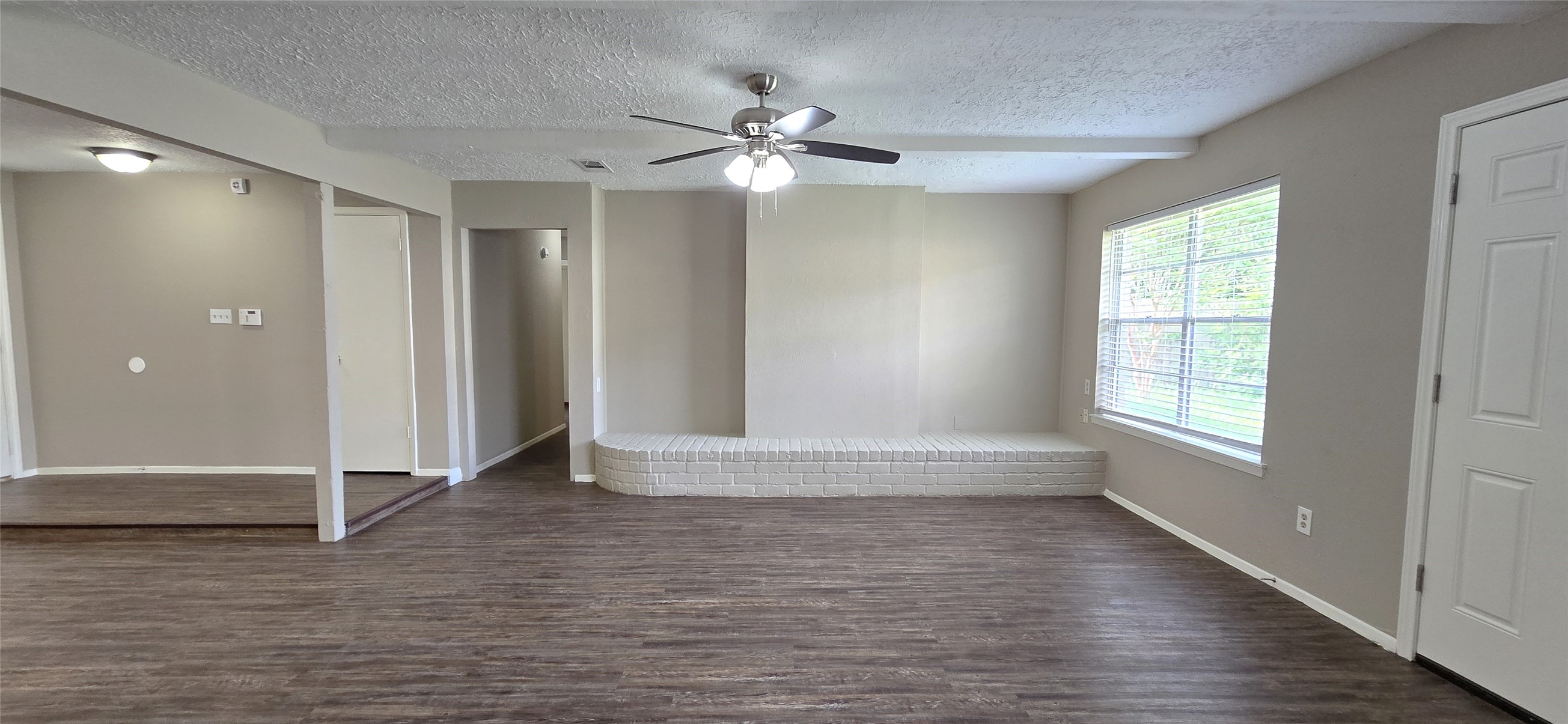 23019 Tree Bright Lane Spring, TX 77373 - Photo 4 of 20 Charming brick bench/ledge and ceiling beams add some character to the room.