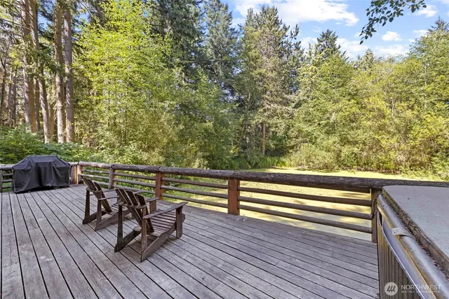a view of outdoor sitting area with furniture and wooden floor