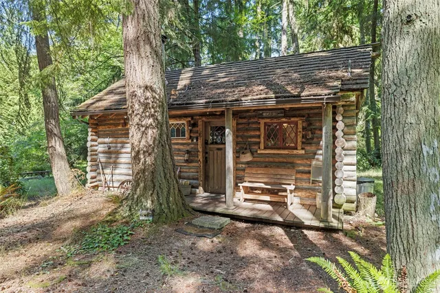 front view of a house with a tree