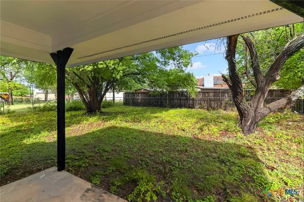 a view of a backyard with garden