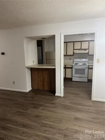a view of kitchen and wooden floor