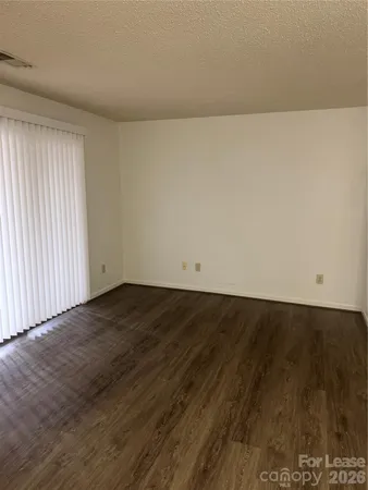 an empty room with wooden floor