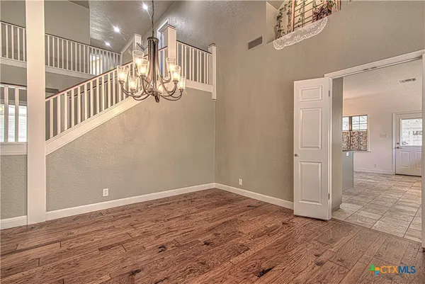 a large kitchen with cabinets a sink appliances and a fireplace