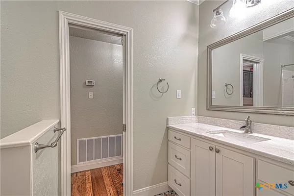 a view of bathroom with a shower and a toilet
