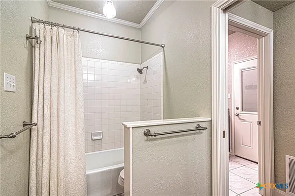 a bathroom with a toilet a sink a mirror a and vanity