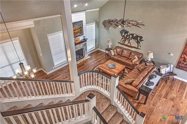 a view of entryway livingroom and hall with wooden floor