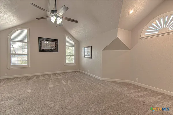 wooden floor in a room with a large mirror