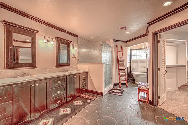 a view of a walk in closet and bedroom