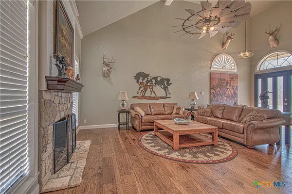 a living room with furniture and a table