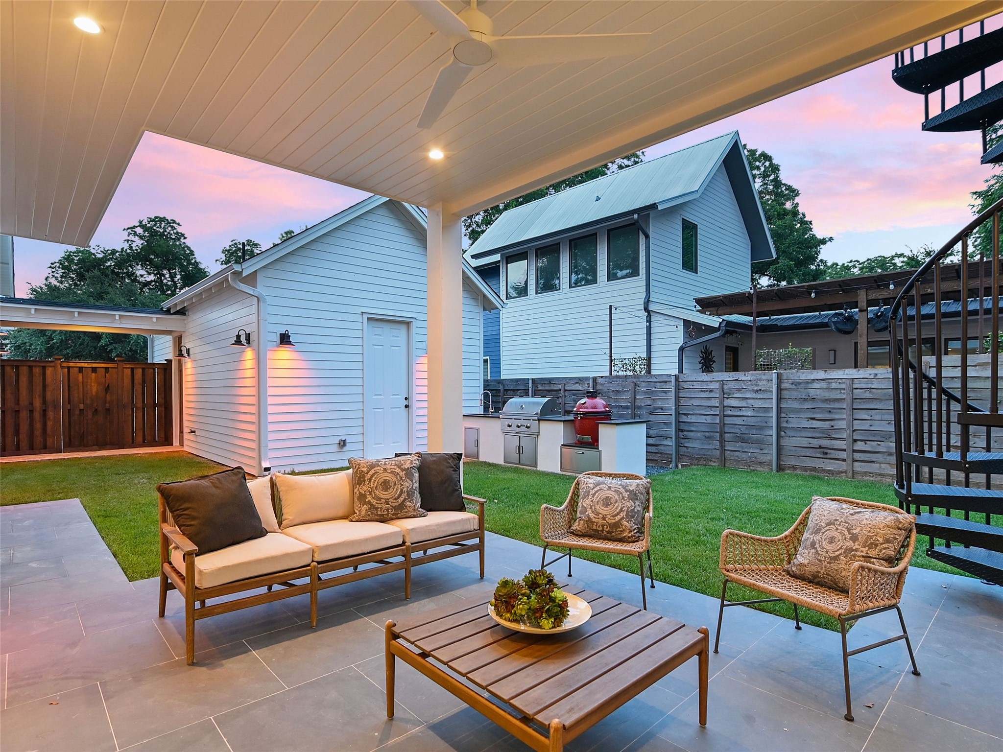 1603 Willow Street Austin, TX 78702 - Photo 28 of 30 a backyard of a house with fire pit and couch