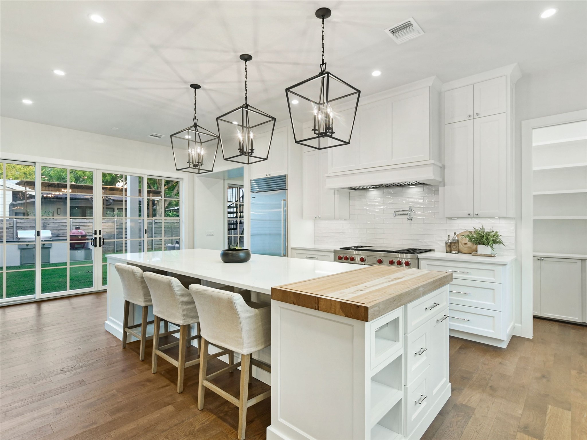 1603 Willow Street Austin, TX 78702 - Photo 9 of 30 a kitchen with a stove a table and chairs in it