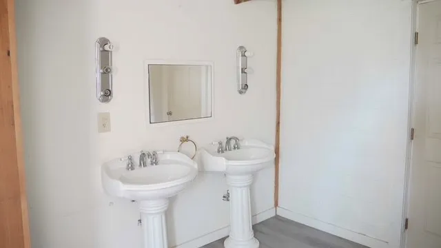 a bathroom with a sink and mirror