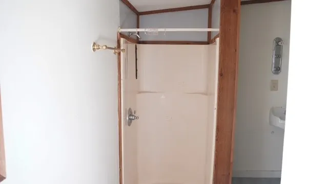 a bathroom with a glass shower door