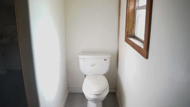 a bathroom with a toilet and a sink