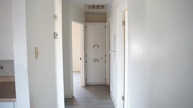 a view of a bathroom with a shower and a sink