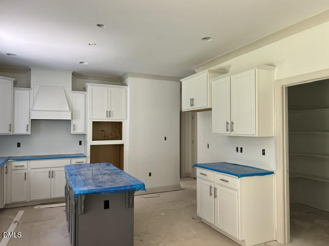 119 Big Pine Road Clayton, NC 27520 - Photo 8 of 21 a kitchen with stainless steel appliances granite countertop a sink stove and refrigerator