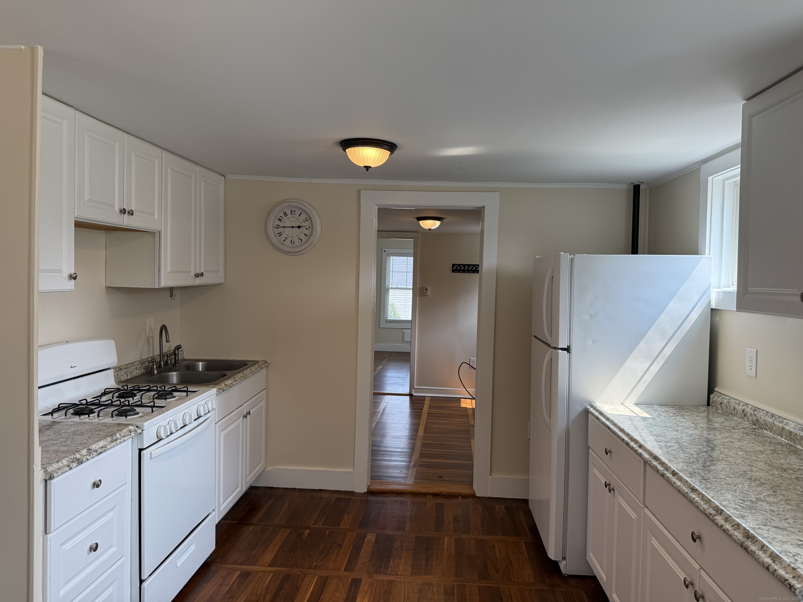 82 Boston Post Road Windham, CT 06226 - Photo 1 of 1 a kitchen with a sink and a refrigerator