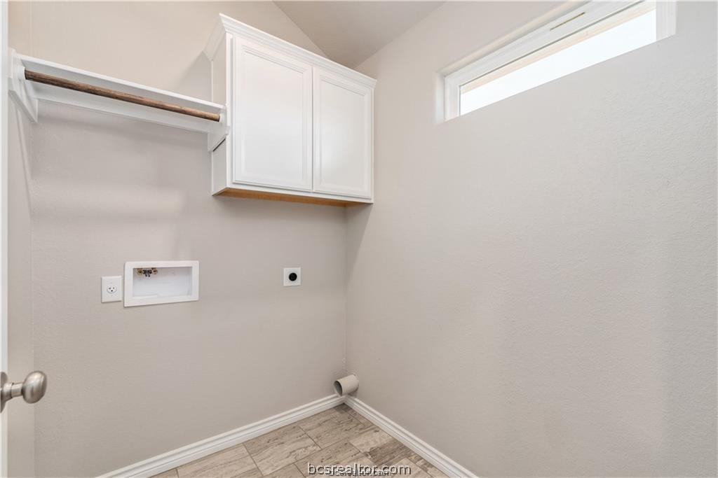 3185 Normandy Way Bryan, TX 77808 - Photo 14 of 16 a view of storage and utility room with wooden floor