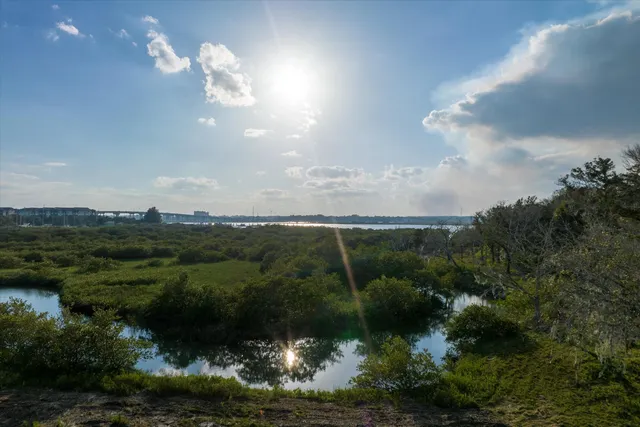 an aerial view of a houses with yard